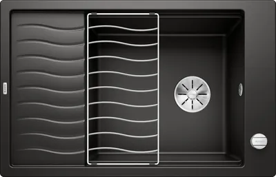 A top-down view of a black kitchen sink with a dish rack and drain.
