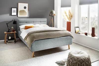 Produktbild von Meise Möbel Stauraumbett Lotte 140x200 cm | Bettkasten & Lattenrost | Webstoff Pastellblau | Holzfuß eichefarbig