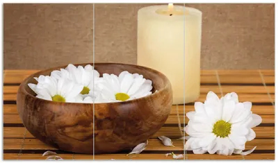 Produktbild von Wallario Herdabdeckplatte aus Glas, Größe 90 x 52 cm 3-teilig, Motiv Stillleben - Kerzen und Blumenblüten in Holzschale