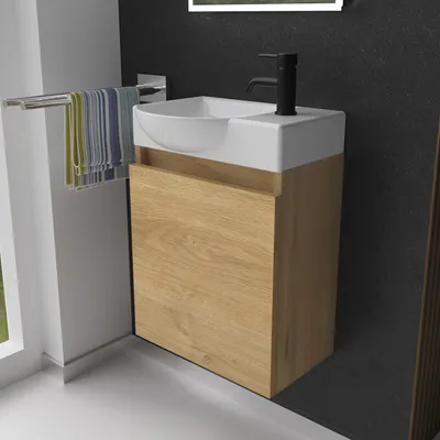 A modern bathroom vanity with a sink and faucet.