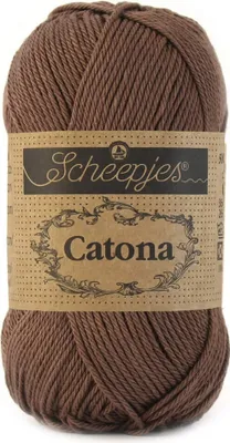 A ball of brown yarn with a label.
