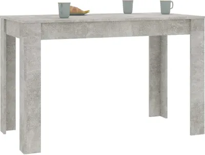 A table with two cups and a piece of food on it, set against a white background.