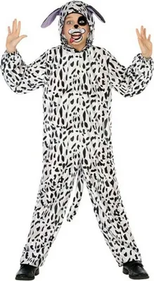 A child wearing a dalmatian costume, standing with arms raised.