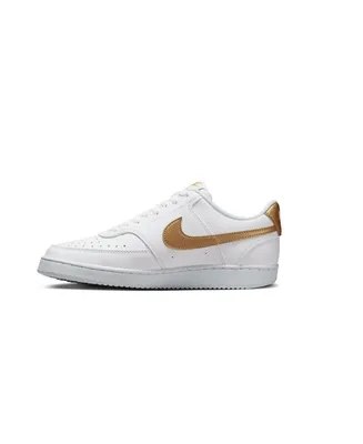 A white Nike Court Vision Lo NN shoe with gold accents is shown against a white background.