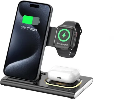 A black wireless charging station with a phone, smartwatch, and earbuds on it.