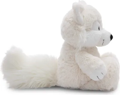 A side profile of a white plush arctic fox toy.