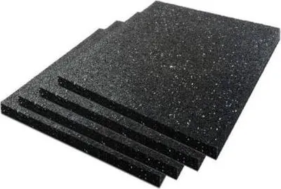A stack of black anti-vibration pads with white flecks, shown from a diagonal angle against a white background.