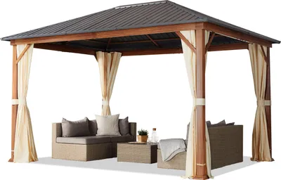 A gazebo with outdoor furniture inside, set against a white background.
