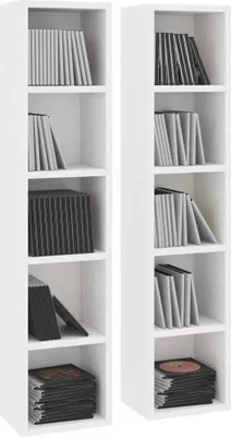Two tall, narrow white shelving units filled with CDs or DVDs.