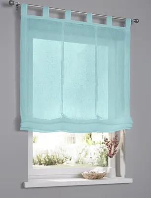 A turquoise roman blind is shown hanging on a window.