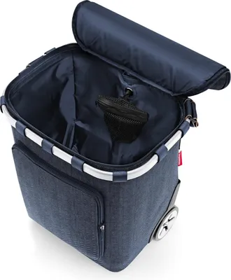 A blue shopping trolley with a lid open, showing the interior.