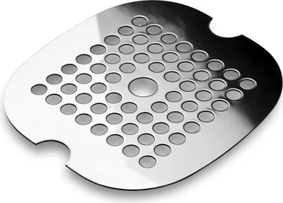 A silver metal shower drain grate with many circular holes and a central raised circle.