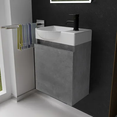 A modern bathroom vanity with a sink and faucet.