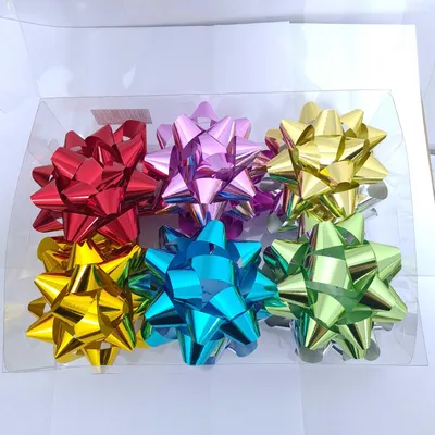 Produktbild von Kleberosetten 11 cm Farbmix 12 Stk. 1 Packung.
