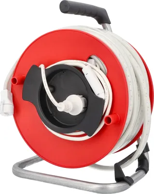 A red cable reel with a white extension cord wound around it, resting on a gray metal stand.