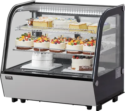A commercial display refrigerator filled with cakes and pastries.