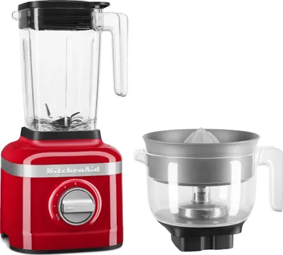 A red KitchenAid blender and a citrus juicer attachment are displayed against a white background.