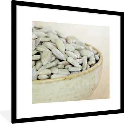Produktbild von MuchoWow® Gerahmtes Poster Schale mit weiß gefärbten Sonnenblumenkernen 40x40 cm - Poster mit Schwarzem Bilderrahmen Wandposter Rahmen Foto Bilder - Poster - Plakat im Rahmen