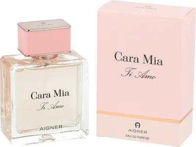 A bottle of Aigner Cara Mia Ti Amo Eau de Parfum for women and its matching pink box are displayed side-by-side against a white background.