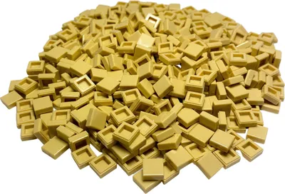 A pile of small, square, tan-colored LEGO tiles.