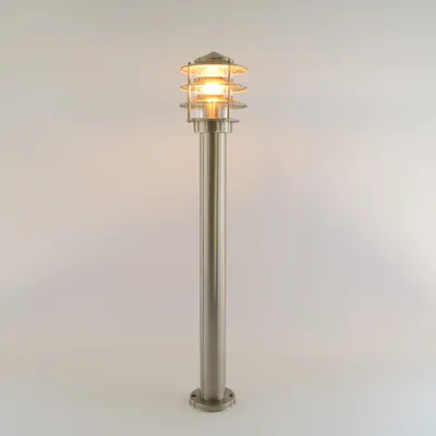 A silver outdoor pedestal lamp with a tiered glass shade is shown against a plain background.