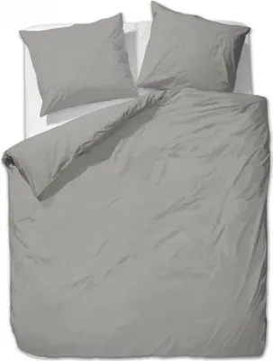 A top-down view of a grey duvet and two grey pillowcases laid out on a white surface.