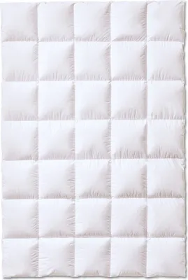 A white down comforter is shown flat against a white background.