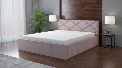 A modern bedroom setting with a pink upholstered bed, mattress, and bedside table.