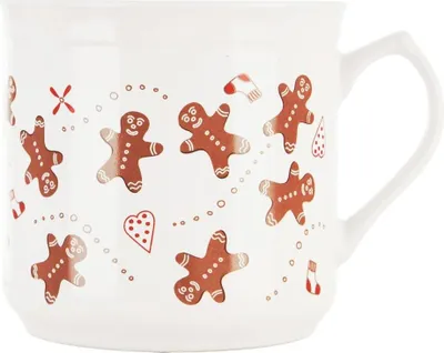 A white ceramic mug with a gingerbread man pattern.