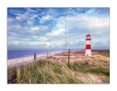 Produktbild von Wallario Herdabdeckplatte aus Glas, Größe 70 x 52 cm 2-teilig, Motiv Leuchtturm am Strand von Sylt