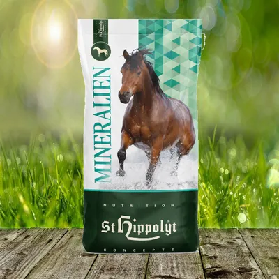 A bag of horse feed with a horse running through water on it, set against a blurred background of grass and sunlight.