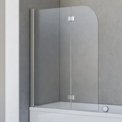 A shower screen for a bathtub against a grey tiled wall.