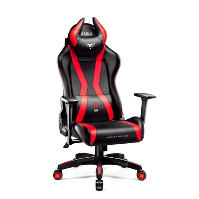 A black and red gaming chair with devil horns on the headrest, presented against a white background.