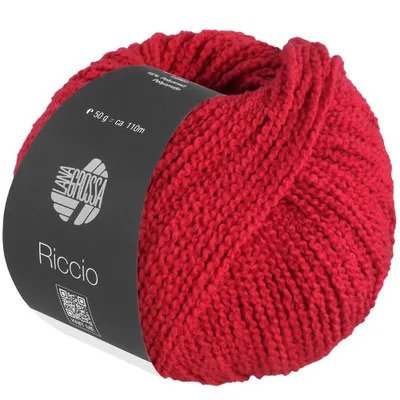 A ball of red yarn with a label wrapped around it.