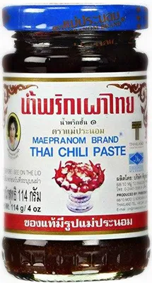 A jar of Thai chili paste with its label prominently displayed.