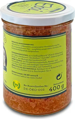 A jar of dog food with labels and nutritional information.