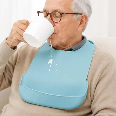 Imagen del producto de Baberos de silicona para adultos, impermeables, con recogemigajas, ajustables, en color azul claro