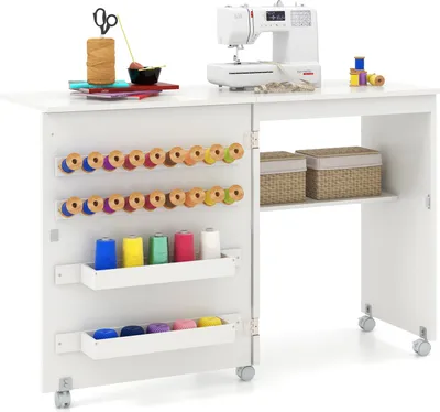 A white sewing cabinet with a sewing machine on top and various sewing supplies organized inside.