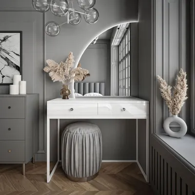 A modern vanity table with a mirror and stool in a well-decorated room.