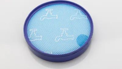 A circular blue vacuum cleaner filter with a purple rim, set against a plain white background.