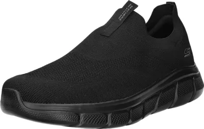 A single black slip-on shoe is shown from a side-diagonal angle against a white background.