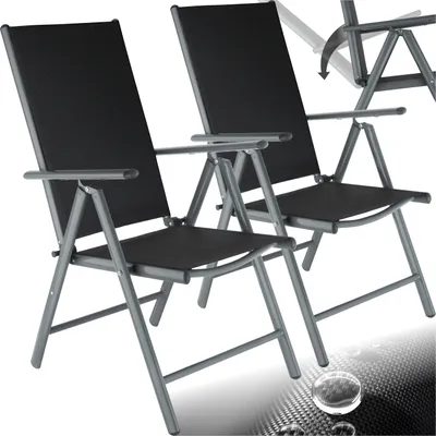 Two black folding garden chairs with gray metal frames are shown against a white background. A subtle, abstract pattern with water droplets is visible in the lower right corner.