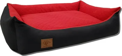 A dog bed is shown from a slightly elevated side angle against a white background.