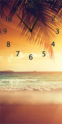 Produktbild von Wallario Design Wanduhr Sonnenuntergang am Strand in der Karibik aus Echtglas, Größe 30 x 60 cm