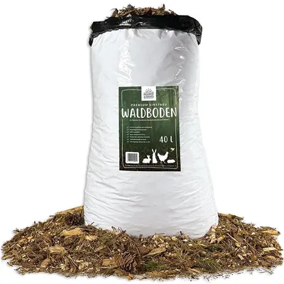 A large bag of animal bedding (Waldboden) is shown, surrounded by loose bedding material.