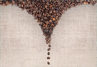 Produktbild von Wallario Fototapete Vliestapete, seidenmatte Oberfläche, einfache Verarbeitung, Größe 200 x 140 cm, Motiv Tasse mit Kaffeebohnen - Kaffeedesign