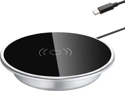 A wireless charging pad with a USB-C cable and connector.