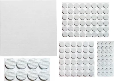 A collage of white felt furniture pads in various sizes, arranged on a white background.
