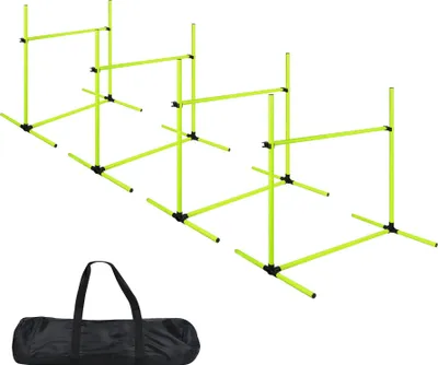 A set of four green agility hurdles and a black carrying bag, isolated on a white background.
