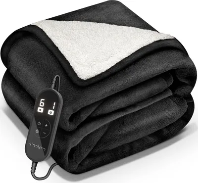 A folded black electric blanket with a white sherpa lining is shown. A black controller with a digital display is attached to the blanket.